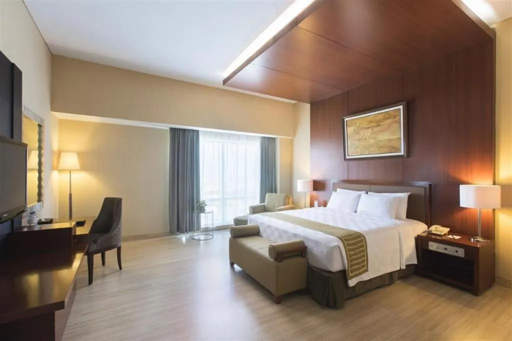 Bed in CLARO Makassar Hotel & Convention