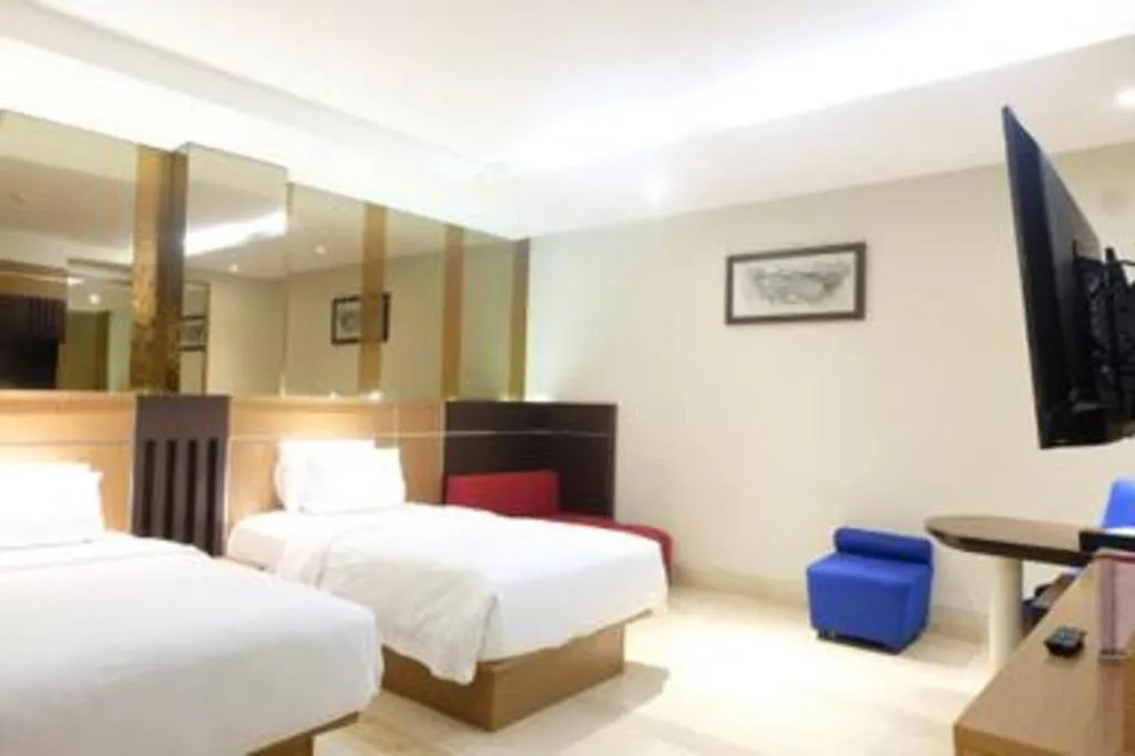 Bed in CLARO Makassar Hotel & Convention