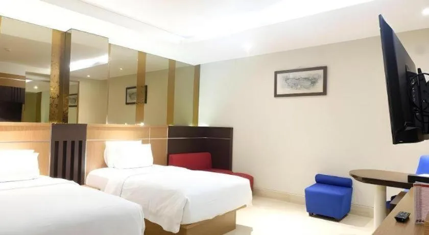 Bed in CLARO Makassar Hotel & Convention