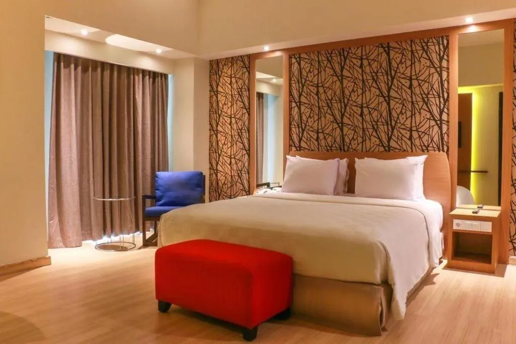 Bed in CLARO Makassar Hotel & Convention