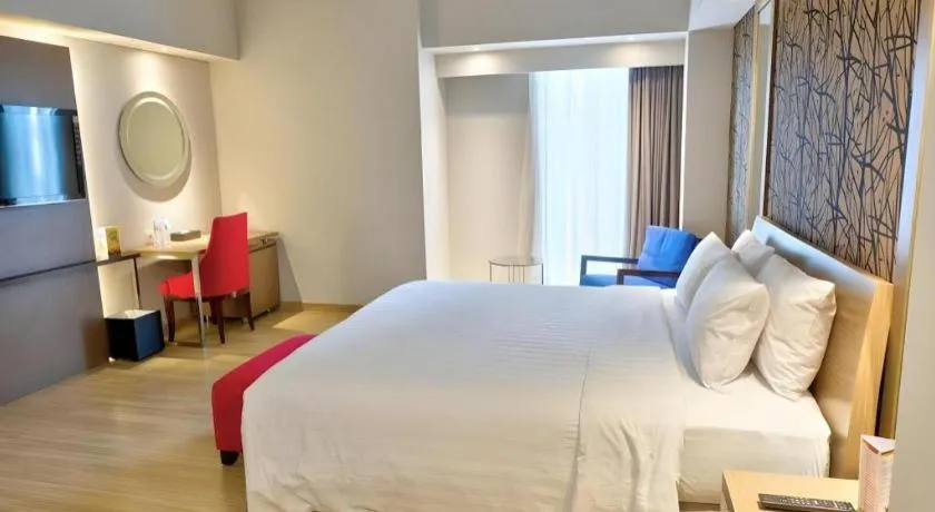 Bed in CLARO Makassar Hotel & Convention