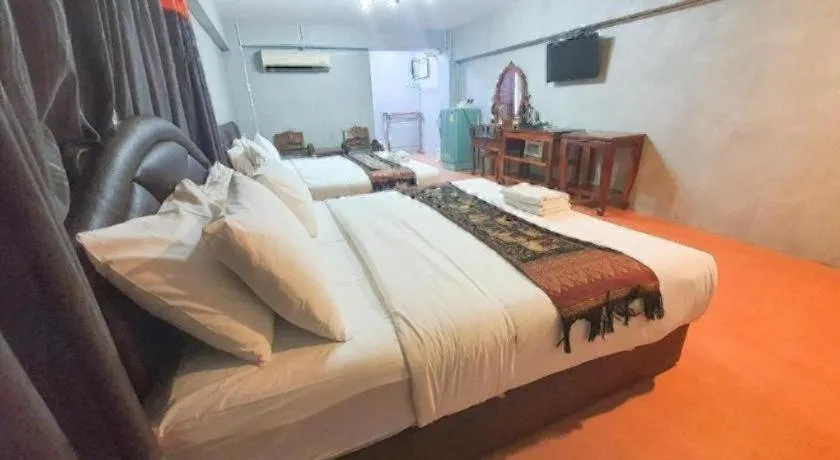Bed in Jirawan Hotel