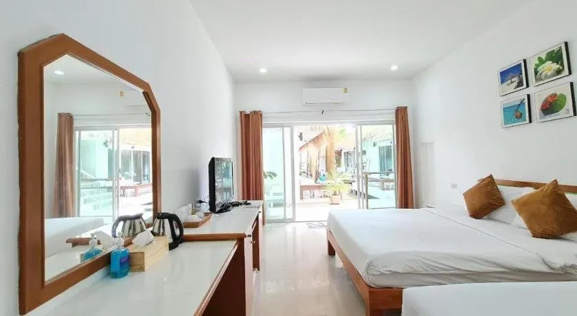 Bed in Sawasdee Coco Resort