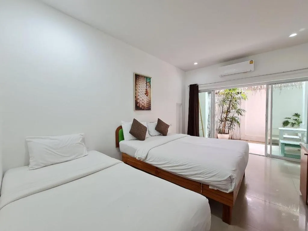 Bed in Sawasdee Coco Resort