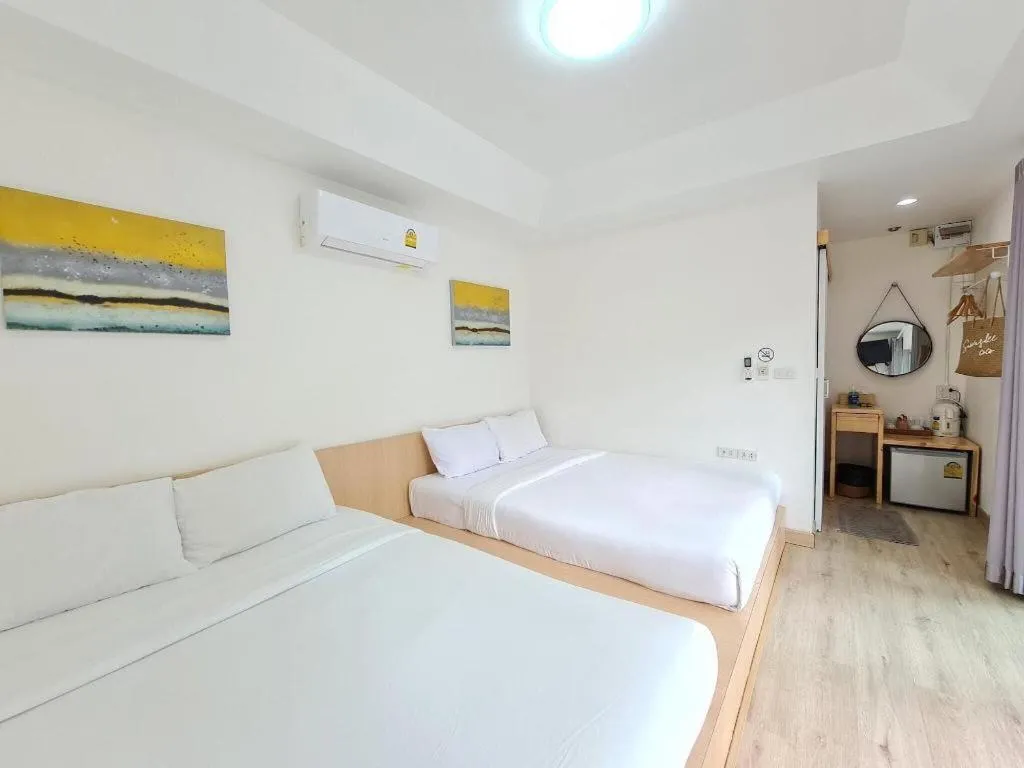 Bed in Sawasdee Coco Resort