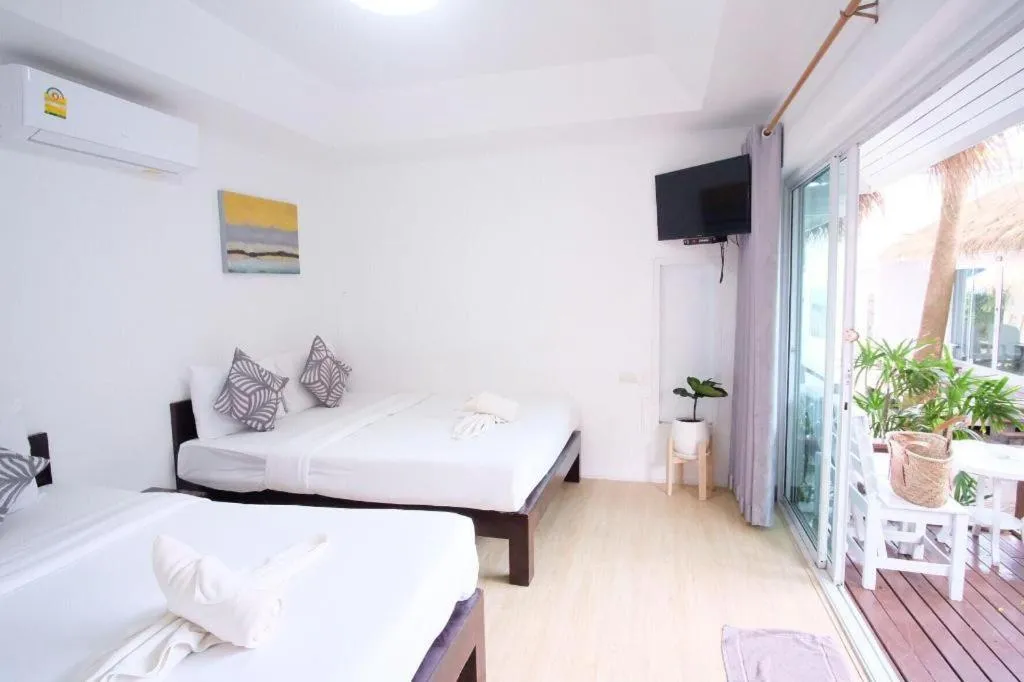 Bed in Sawasdee Coco Resort