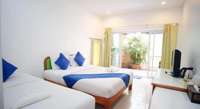 Bed in Sawasdee Coco Resort