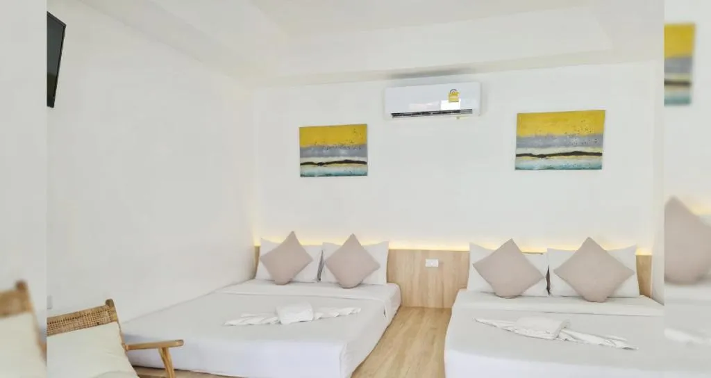 Bed in Sawasdee Coco Resort