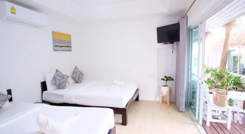 Bed in Sawasdee Coco Resort