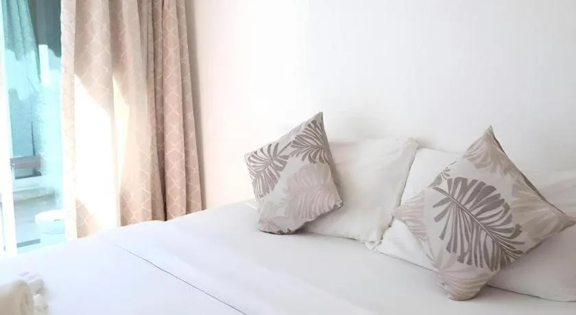 Bed in Sawasdee Coco Resort