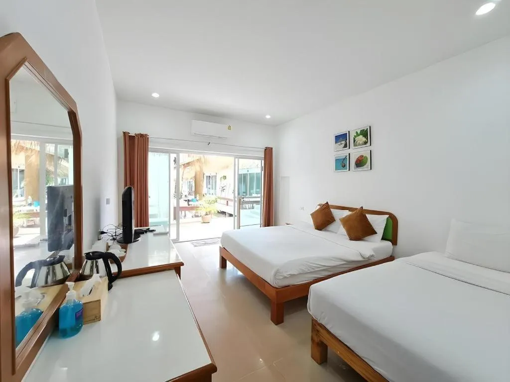 Bed in Sawasdee Coco Resort