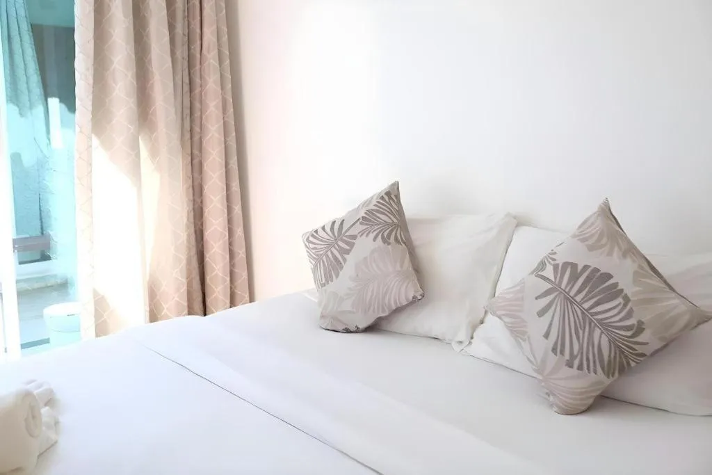 Bed in Sawasdee Coco Resort