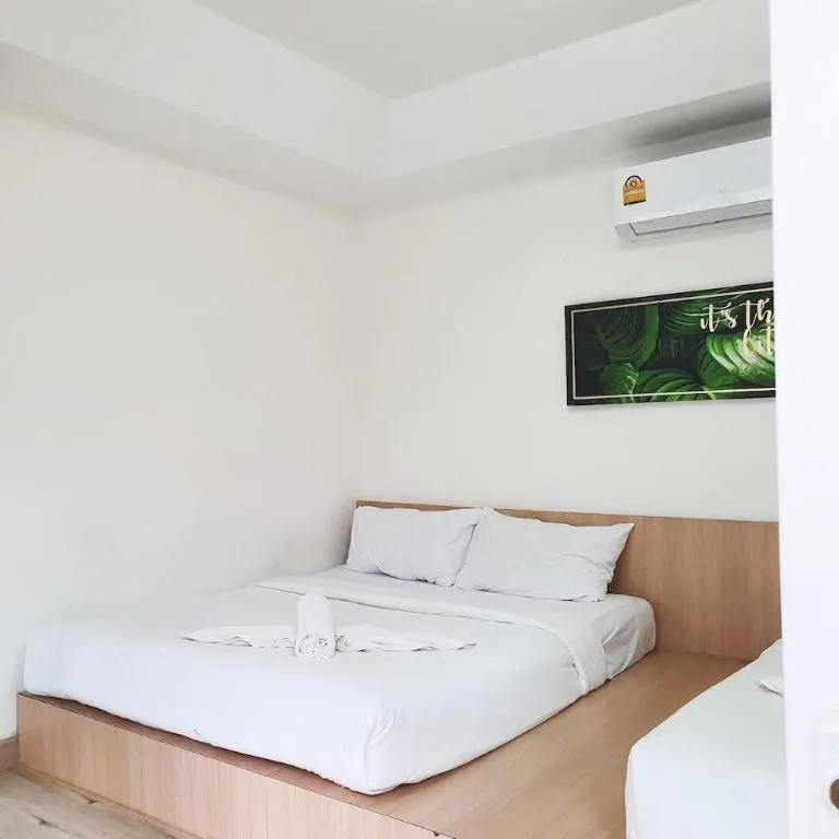 Bed in Sawasdee Coco Resort