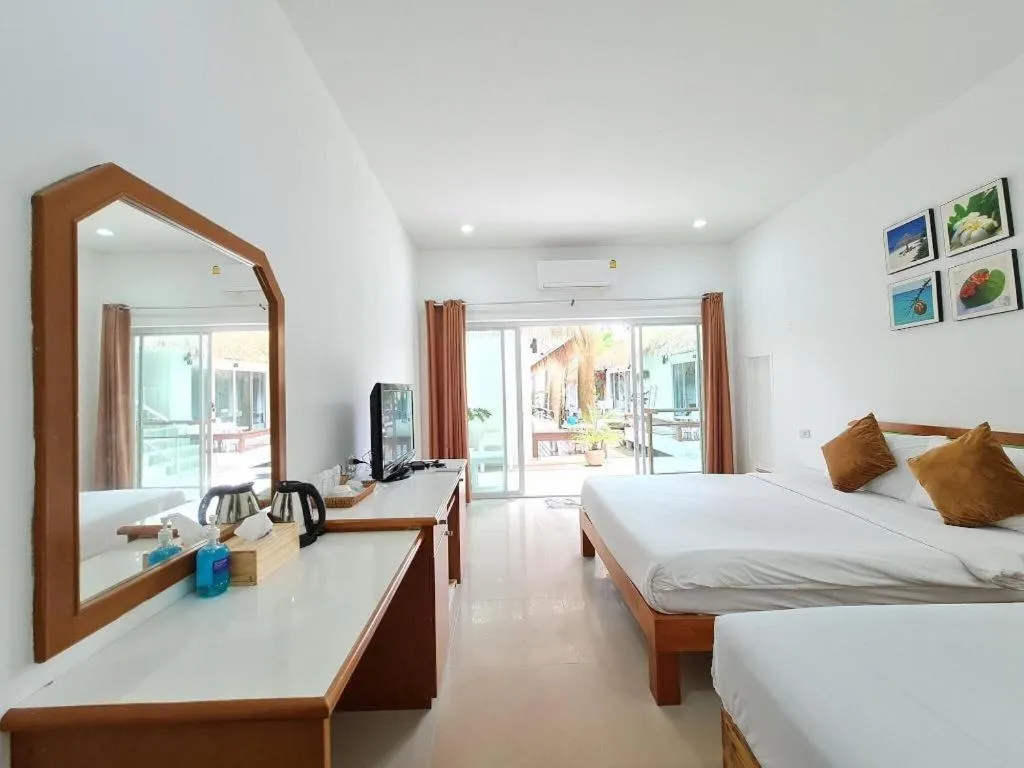 Bed in Sawasdee Coco Resort