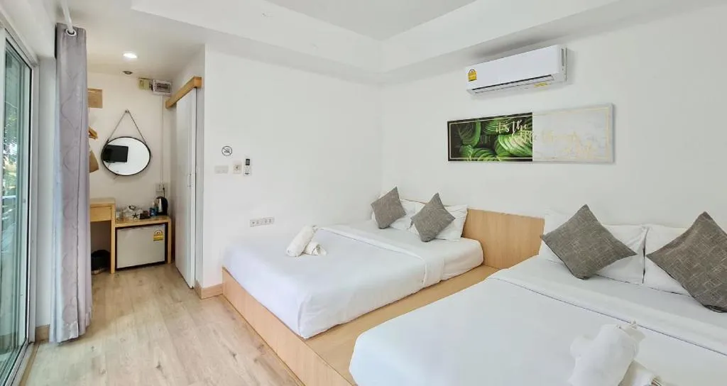 Bed in Sawasdee Coco Resort