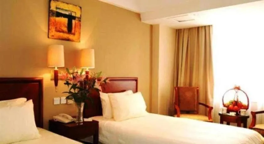 Bed in GreenTree Inn Suites HongQiao Airport Branch