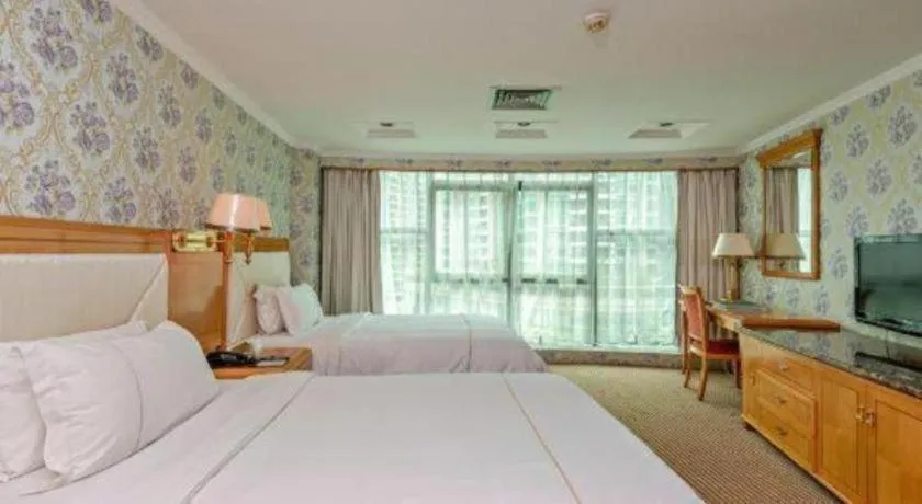 Bed in New Pearl River Hotel