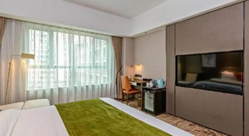 Bed in New Pearl River Hotel