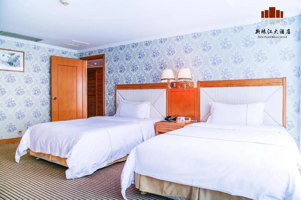 Bed in New Pearl River Hotel