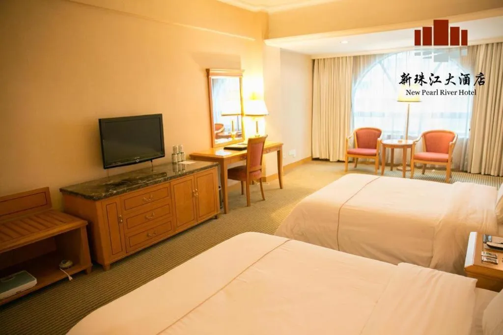 Bed in New Pearl River Hotel