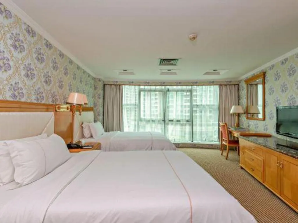 Bed in New Pearl River Hotel