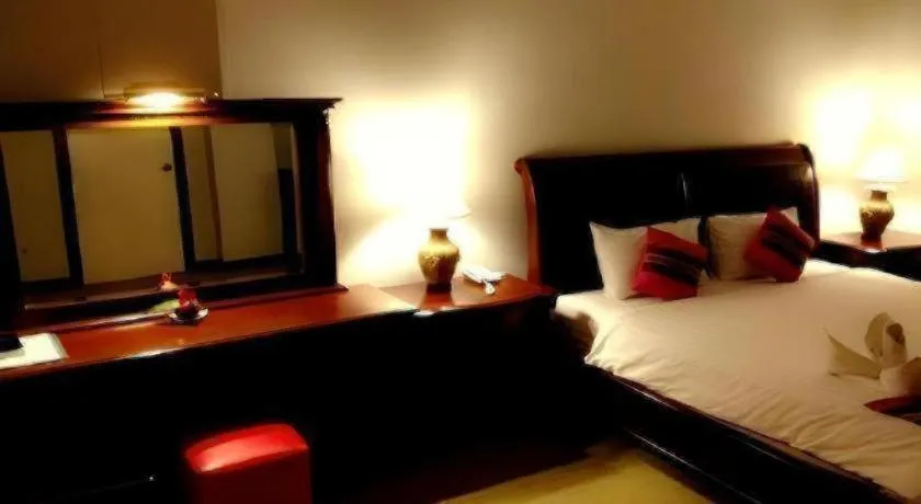 Bed in Thepnakorn Hotel