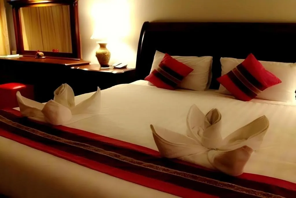 Bed in Thepnakorn Hotel