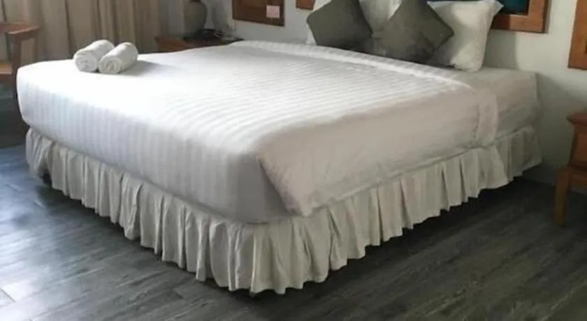 Bed in Thepnakorn Hotel