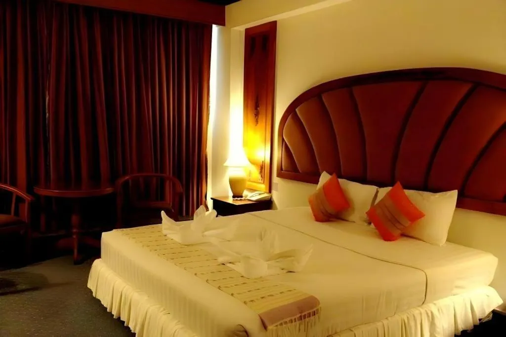 Bed in Thepnakorn Hotel