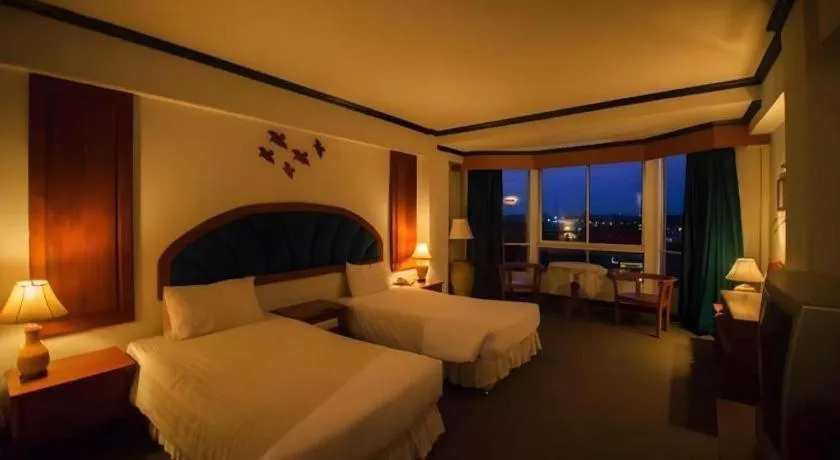 Bed in Thepnakorn Hotel