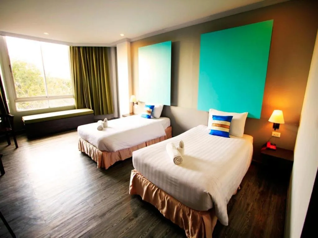 Bed in Thepnakorn Hotel