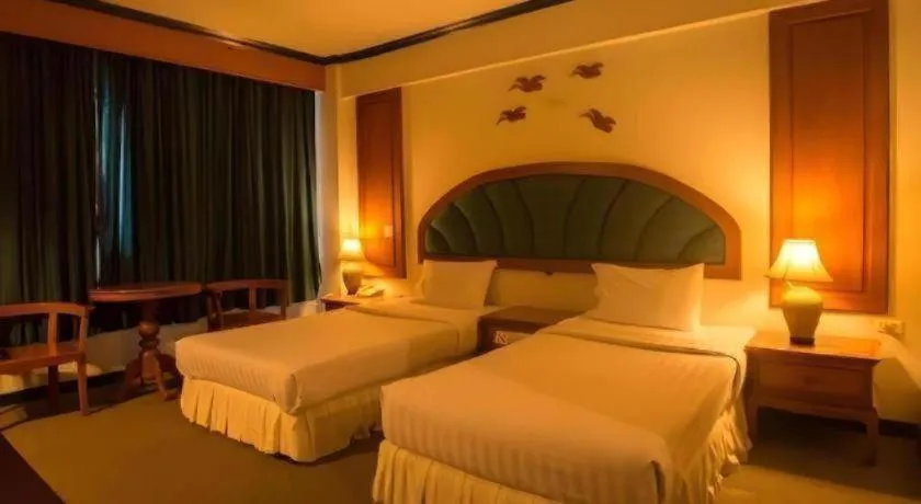 Bed in Thepnakorn Hotel