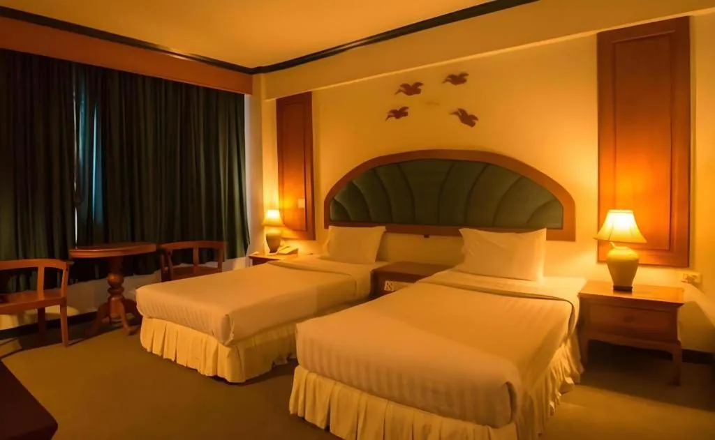 Bed in Thepnakorn Hotel