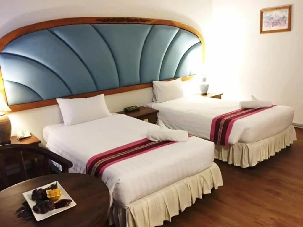 Bed in Thepnakorn Hotel