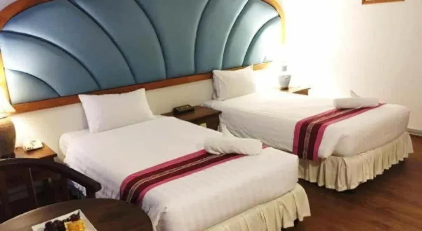 Bed in Thepnakorn Hotel