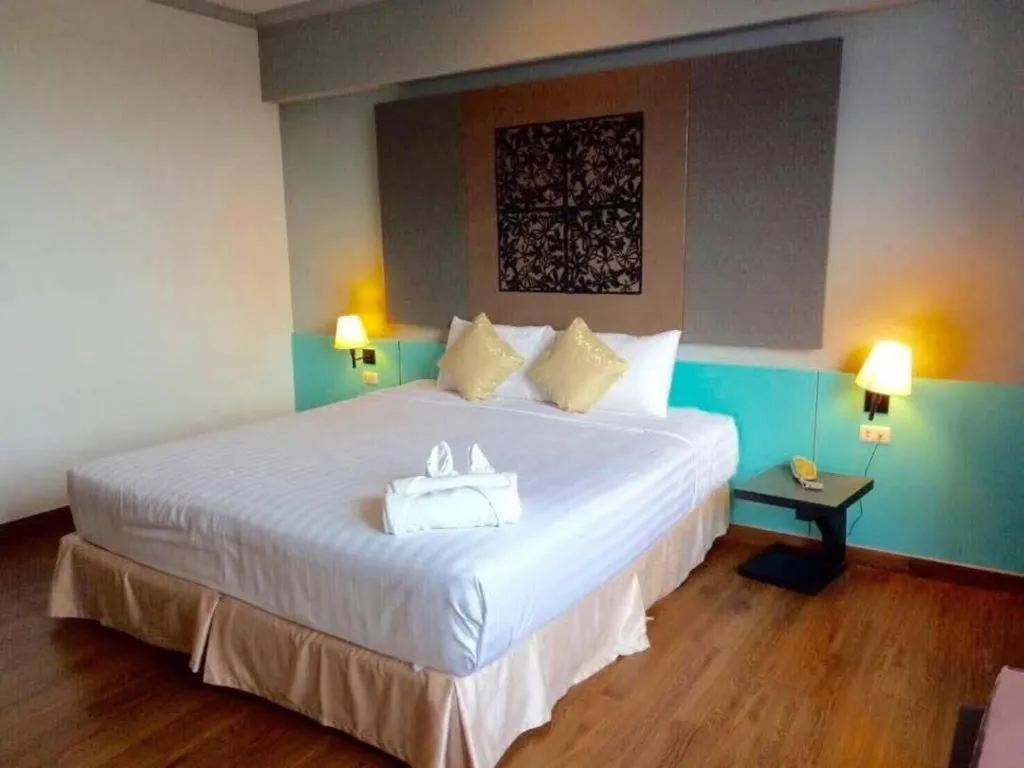 Bed in Thepnakorn Hotel