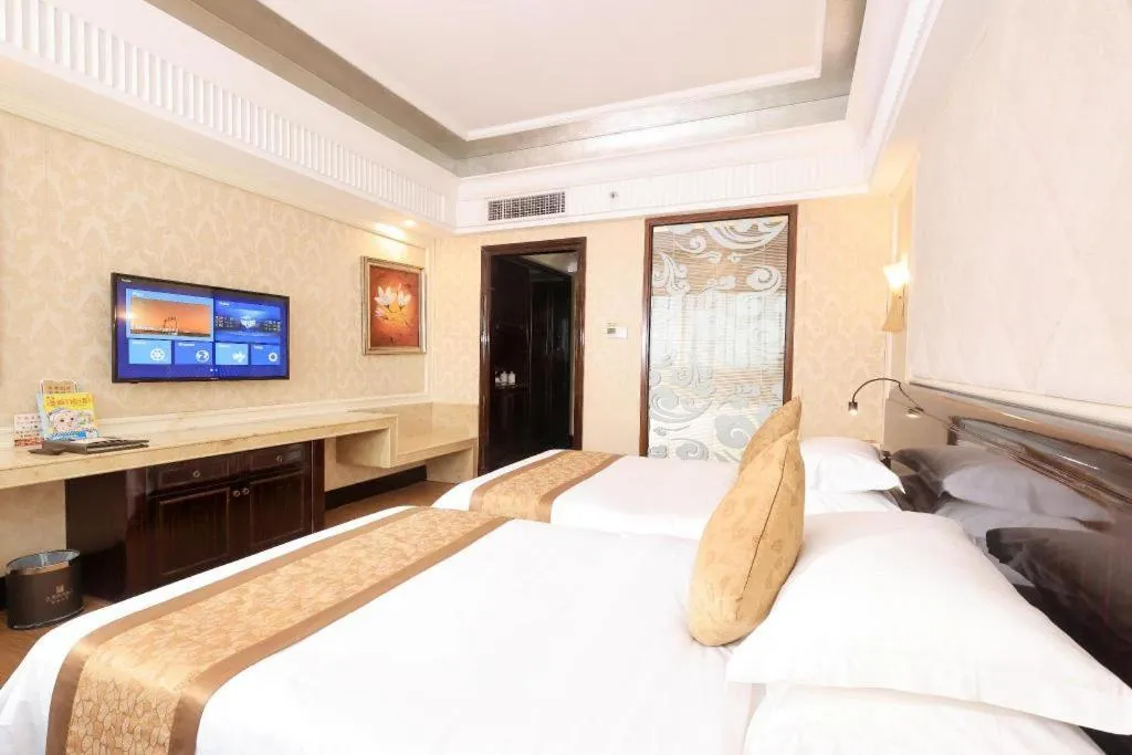 Bed in Sun City Hotel Haikou