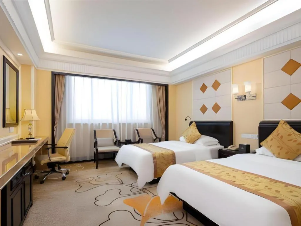 Bed in Sun City Hotel Haikou