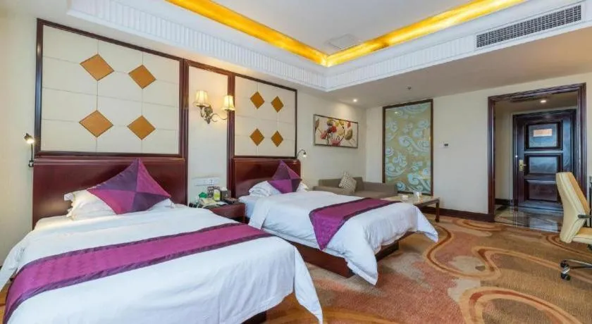 Bed in Sun City Hotel Haikou