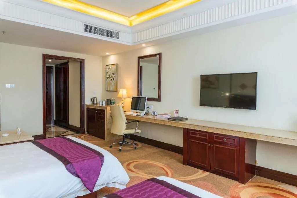 Bed in Sun City Hotel Haikou