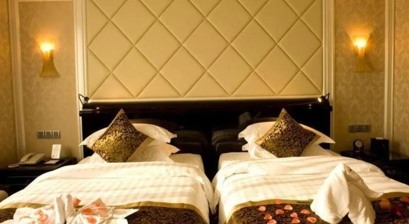 Bed in Sun City Hotel Haikou