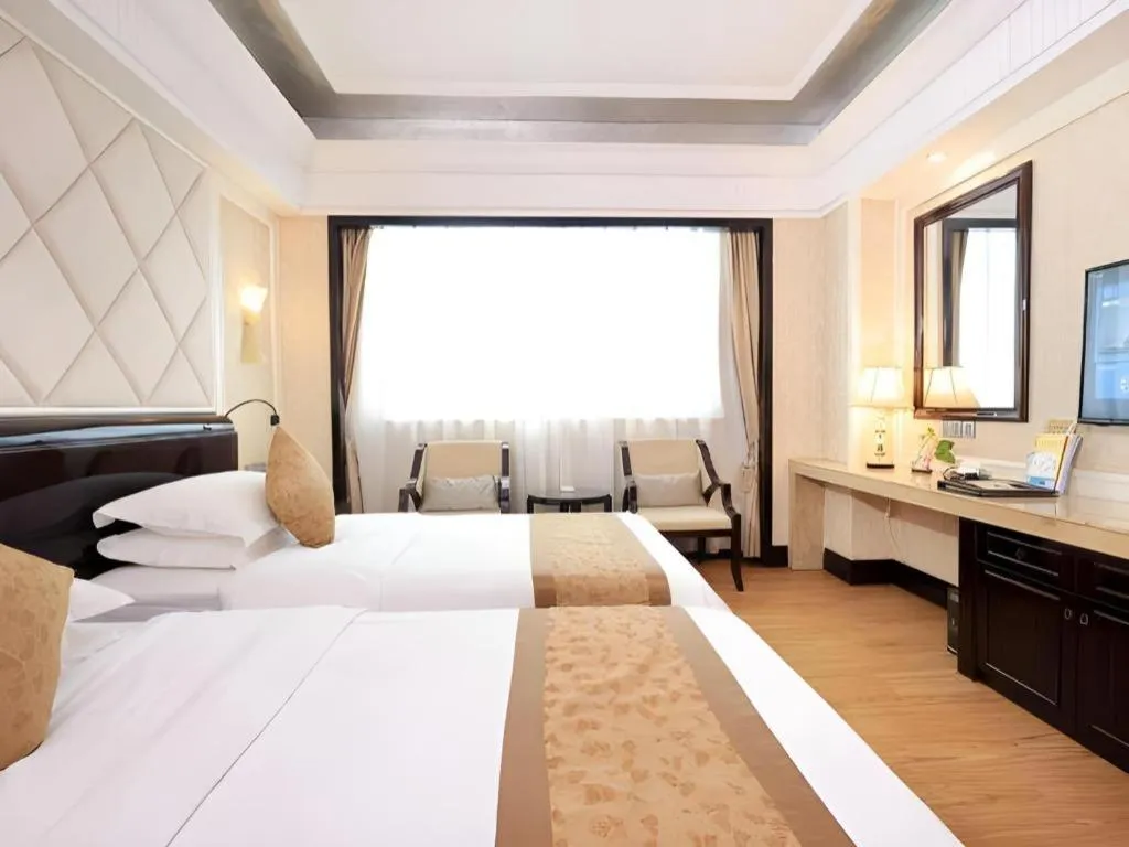 Bed in Sun City Hotel Haikou