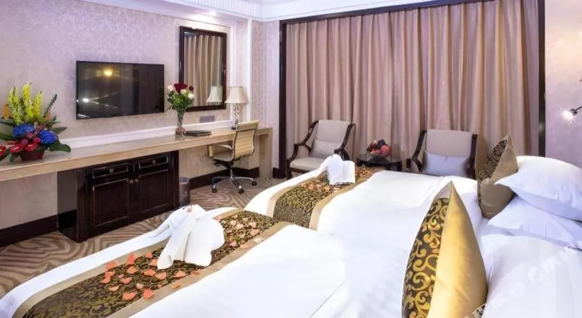 Bed in Sun City Hotel Haikou