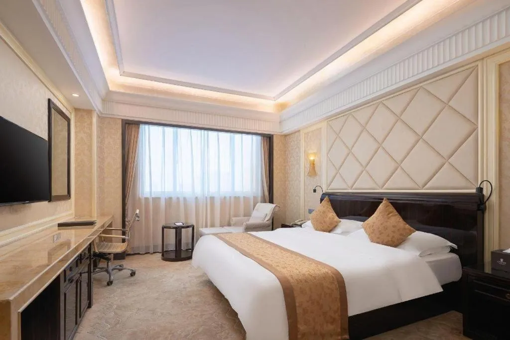 Bed in Sun City Hotel Haikou