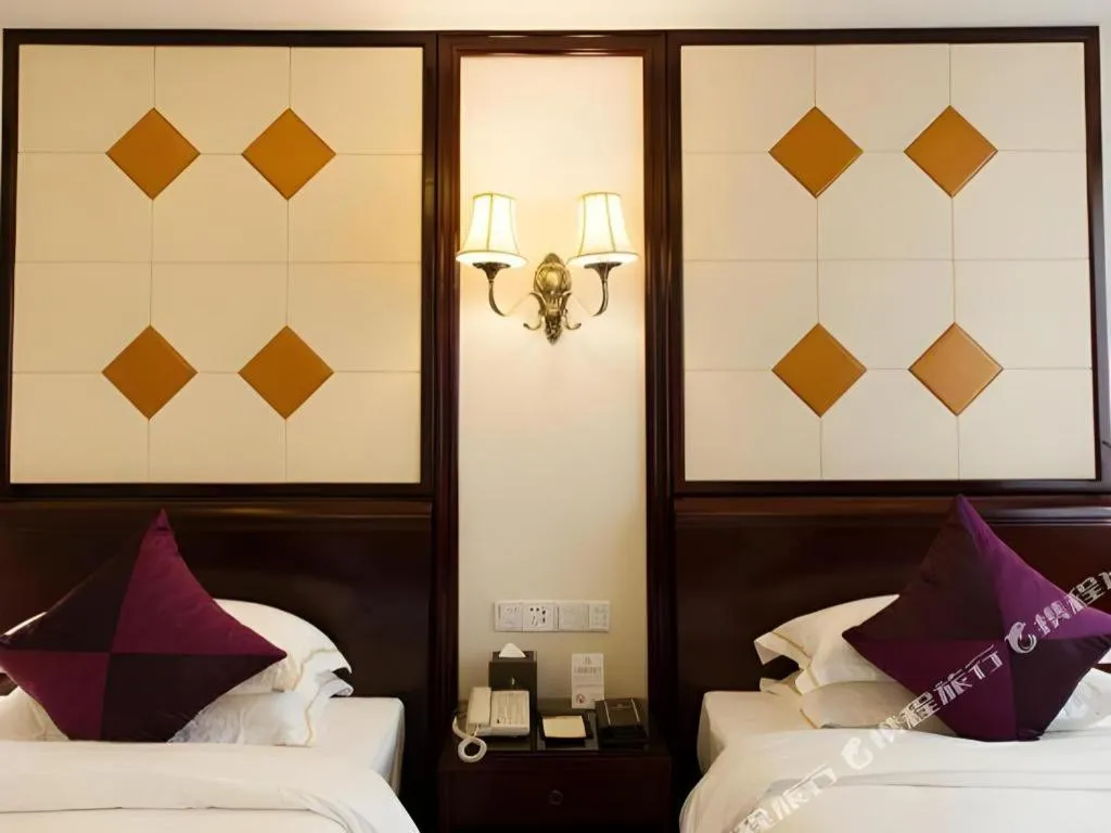 Bed in Sun City Hotel Haikou