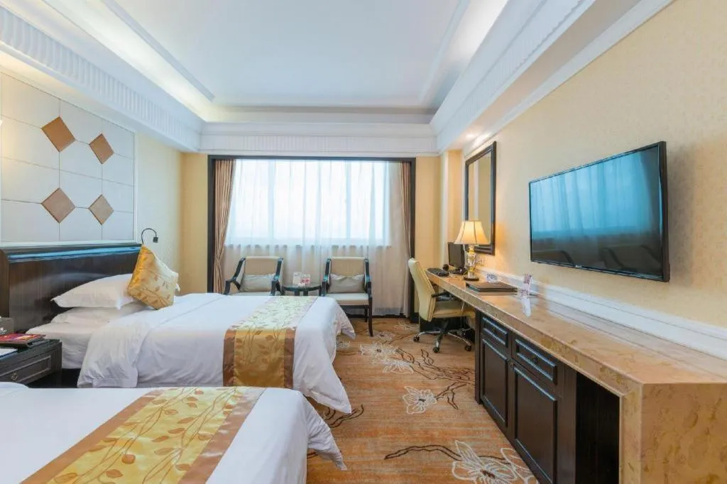 Bed in Sun City Hotel Haikou
