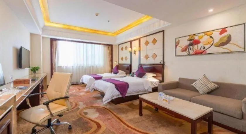 Bed in Sun City Hotel Haikou
