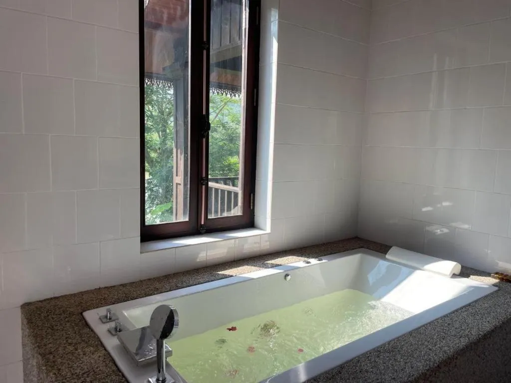 Bed in Nam Ou Riverside Resort