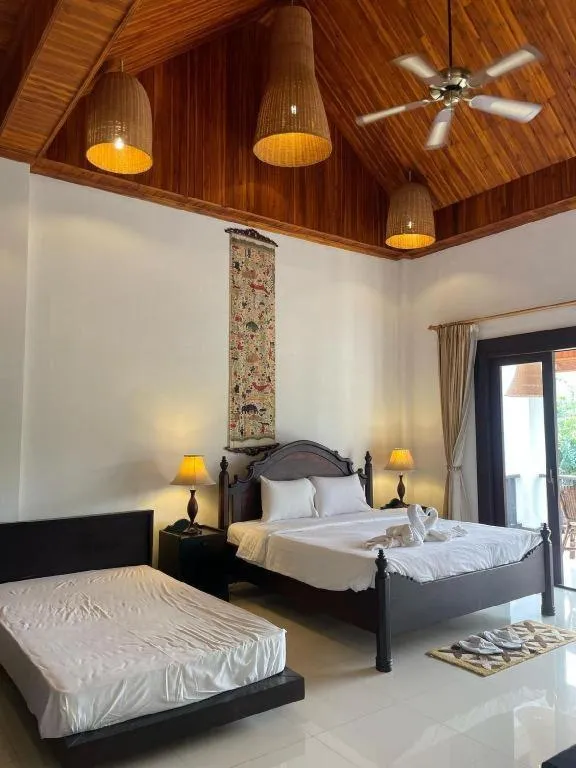 Bed in Nam Ou Riverside Resort