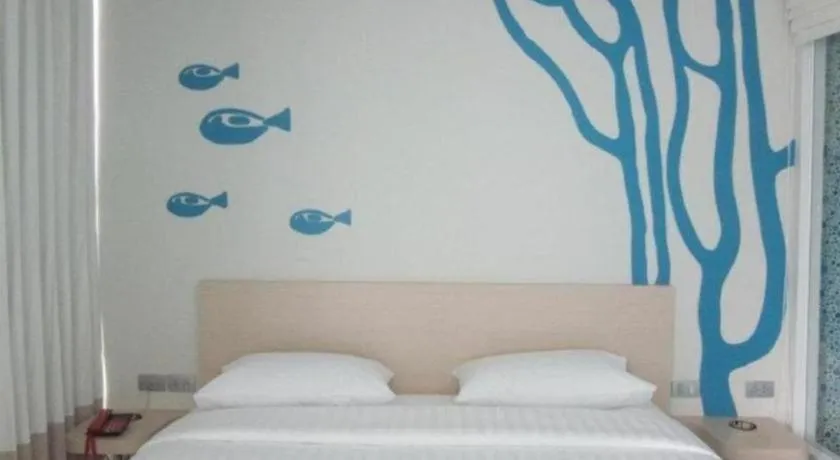 Bed in R-Con Blue Ocean Hotel
